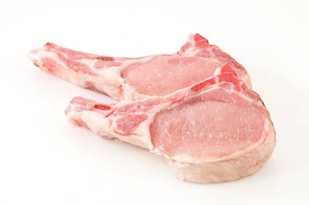 Two Pork Chops Isolated on White Background.